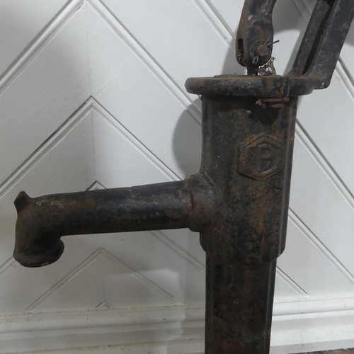 408 - An Antique hand operated cast iron water pump, W 36 cm x H 67 cm x D 16 cm.