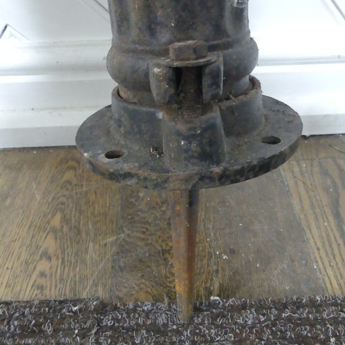 408 - An Antique hand operated cast iron water pump, W 36 cm x H 67 cm x D 16 cm.