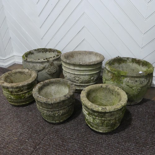 409 - A pair of weathered reconstituted stone Planters decorated with grape vines, together with another l... 