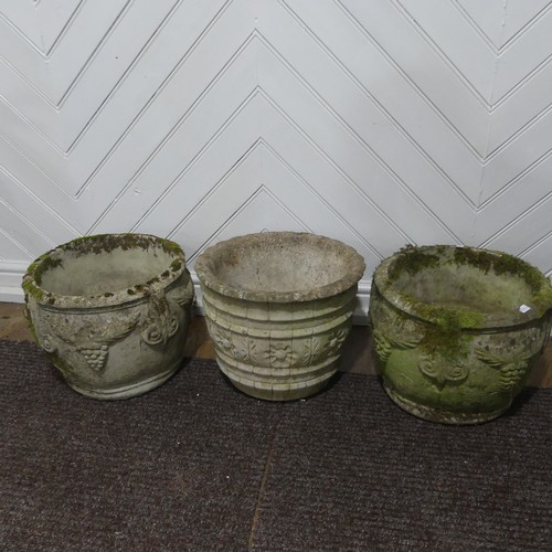 409 - A pair of weathered reconstituted stone Planters decorated with grape vines, together with another l... 