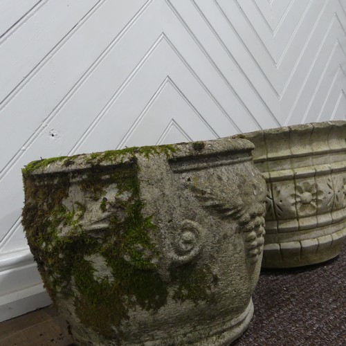 409 - A pair of weathered reconstituted stone Planters decorated with grape vines, together with another l... 