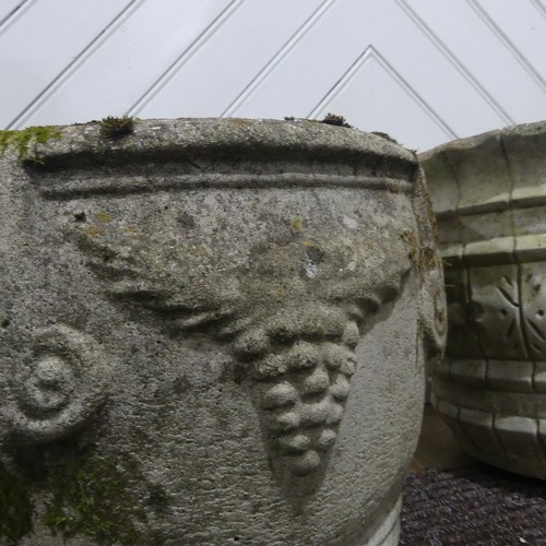 409 - A pair of weathered reconstituted stone Planters decorated with grape vines, together with another l... 