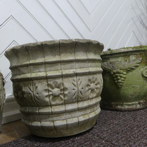 409 - A pair of weathered reconstituted stone Planters decorated with grape vines, together with another l... 