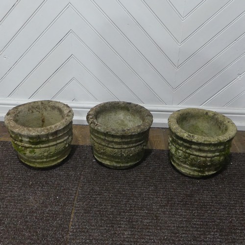 409 - A pair of weathered reconstituted stone Planters decorated with grape vines, together with another l... 