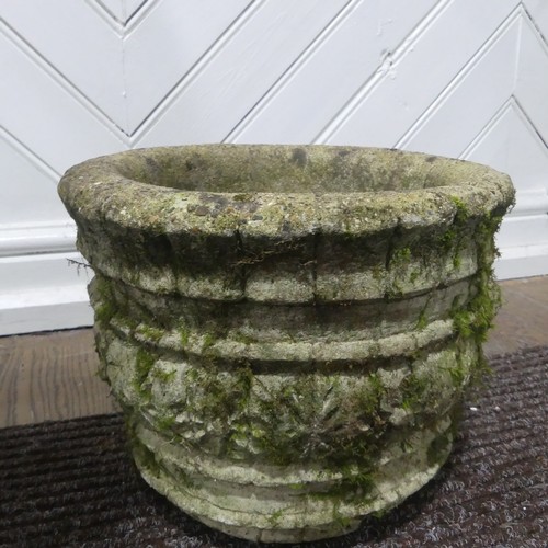 409 - A pair of weathered reconstituted stone Planters decorated with grape vines, together with another l... 