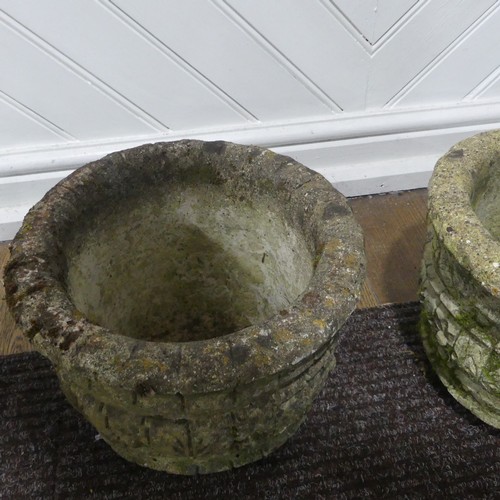 409 - A pair of weathered reconstituted stone Planters decorated with grape vines, together with another l... 