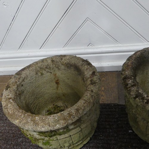 409 - A pair of weathered reconstituted stone Planters decorated with grape vines, together with another l... 