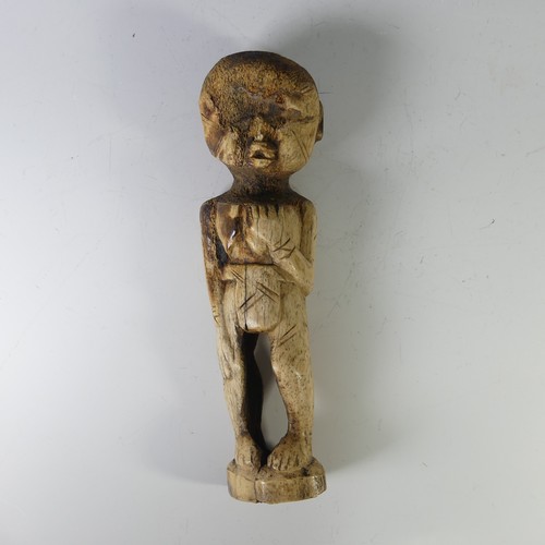 213 - An Inuit Carved Bone Sculpture of standing figure, signed Karoo Ashevak (1940 – October 19, 1974), s... 