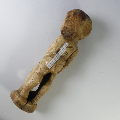 213 - An Inuit Carved Bone Sculpture of standing figure, signed Karoo Ashevak (1940 – October 19, 1974), s... 