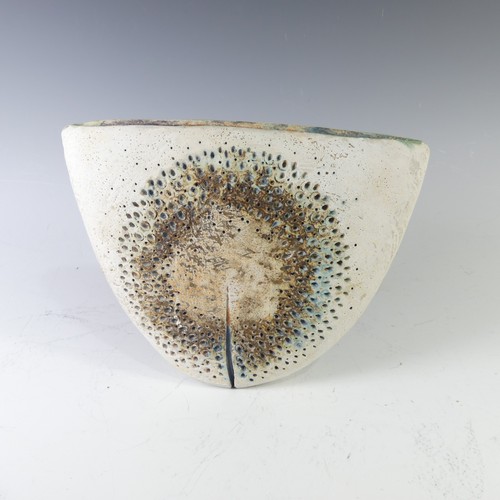 An Alan Wallwork studio pottery 'Delta' Vase, of semi circular flattened form with pierced circular designs and typical split illusion, incised initials to base, W 27cm x H 21cm.