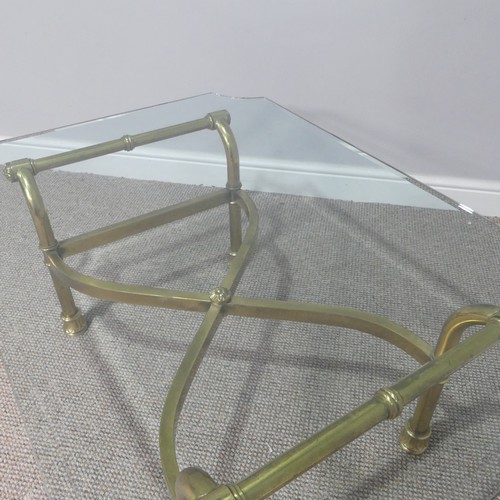 380 - A retro designer Coffee Table, (made in Italy) with shaped bevelled glass top supported by four curv... 