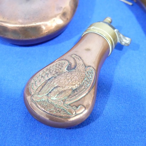 381 - A 19th century copper Powder Flask, of small size embossed with an eagle design, 11cm long, together... 