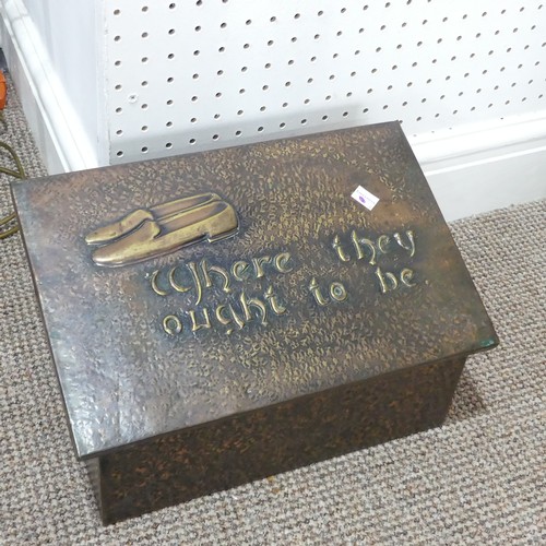 267 - A brass covered Arts and crafts slipper box, the hinged lid designed with a pair of slippers in reli... 