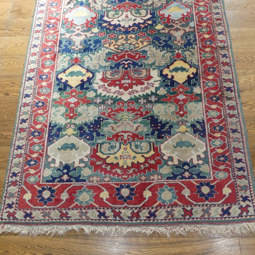 249 - Tribal Rugs: a Turkish hand knotted wool rug, the whole woven with bold geometric patterns in turquo... 