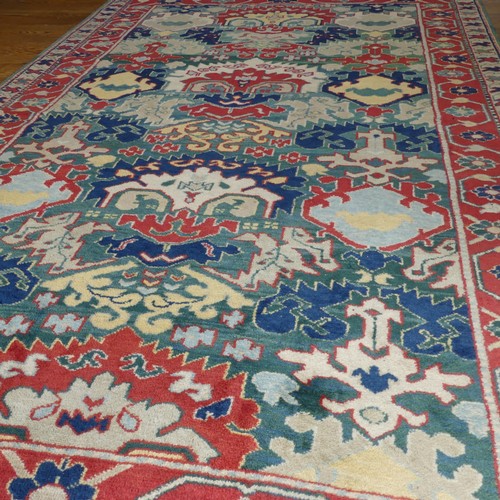 249 - Tribal Rugs: a Turkish hand knotted wool rug, the whole woven with bold geometric patterns in turquo... 