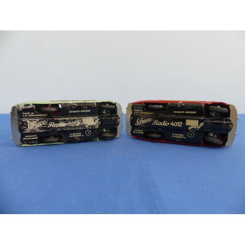 442 - Two Schuco tinplate clockwork vehicles, comprising a red radio 4012 musical car, in good condition, ... 