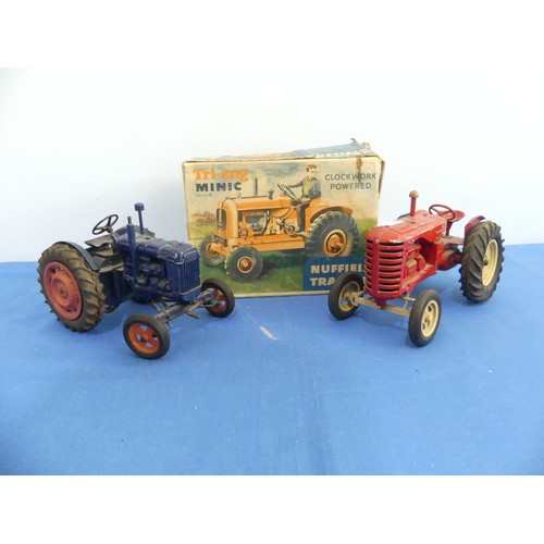 427 - A Lesney Massey-Harris 745 D metal Tractor, together with a Chad Valley Fordson Major Tractor, with ... 