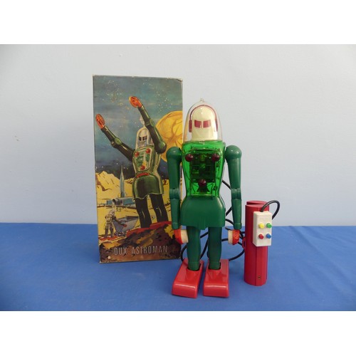 A boxed Nr.150 Dux-Astroman plastic Electric Robot, Western Germany 1950s, green plastic body with red feet and hand controller, white head and clear plastic dome , in original box with inner packing, H 30.5 cm.
