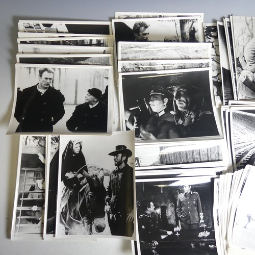 77 - A quantity of black and white Clint Eastwood movie Lobby Cards, including 'The Good The Bad The Ugly... 