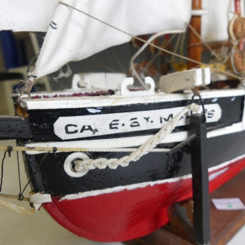 434 - A vintage wooden model three-mast Schooner sailing ship, complete with sails, jibboom, 4 life boats,... 