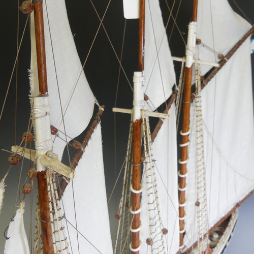 434 - A vintage wooden model three-mast Schooner sailing ship, complete with sails, jibboom, 4 life boats,... 