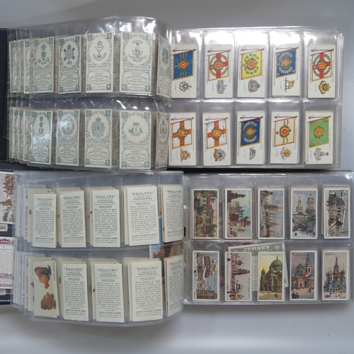 73 - Cigarette Cards: four albums of cigarette cards, mainly 'military' issues, including Wills' Allied A... 