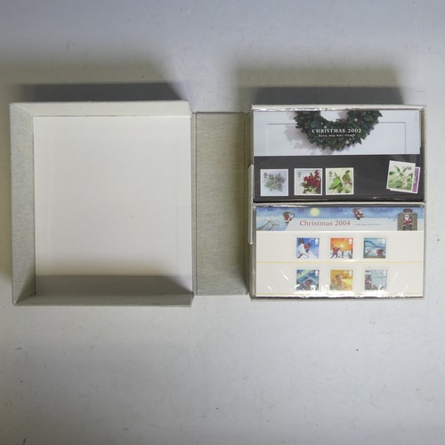 93 - A collection of Great British mint Stamps, in five cases with presentation packs with issues to £10,... 