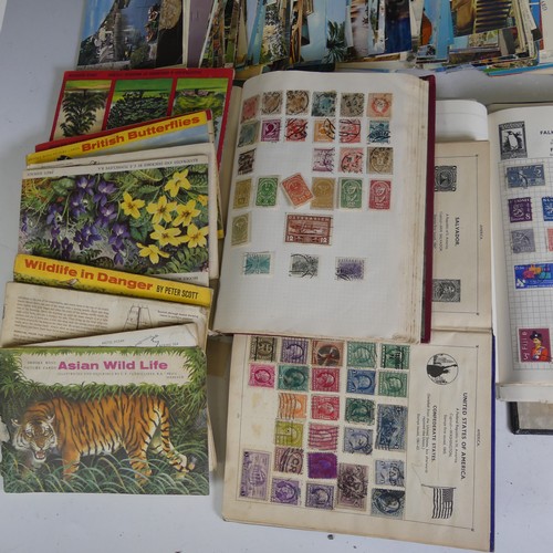 88 - A large collection of Stamps in seven albums and various loose stamps on envelopes, together with a ... 