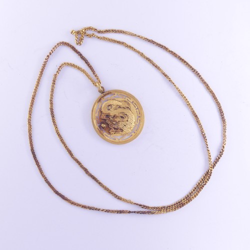 453 - A Chinese circular gold Pendant Medallion, the front with dragon chasing the pearl, the reverse with... 