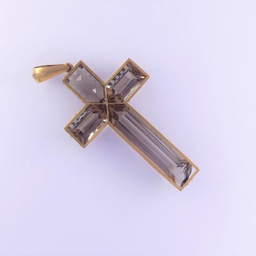 456 - A large smoky quartz Cross Pendant, with four facetted quartz stones claw set in unmarked yellow gol... 