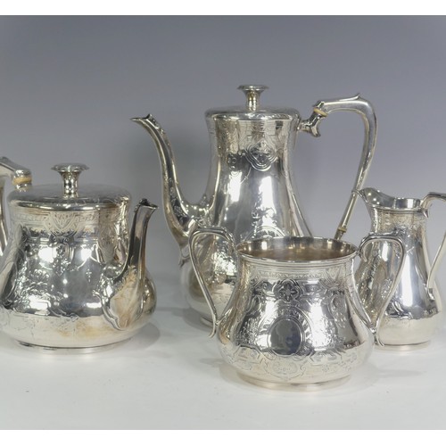 A Victorian silver four piece Tea Set, by William Hunter & Son, hallmarked London, 1866, of baluster form, with foliate bright cut decoration and vacant cartouche, the teapot and coffee pot with ivory insulated handles, coffee pot, 22cm high, approx total weight 62ozt (4).  DEFRA Ivory Act submission ref: HX4P436X