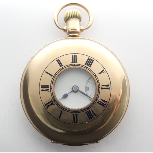 215 - A 9ct gold Half Hunter Pocket Watch, the white enamel dial with Arabic Numerals and subsidiary secon... 