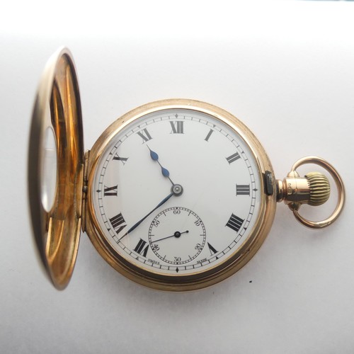 215 - A 9ct gold Half Hunter Pocket Watch, the white enamel dial with Arabic Numerals and subsidiary secon... 