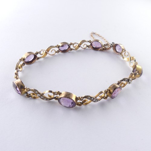 391 - An early 20thC amethyst and seed pearl Bracelet, the eight oval facetted amethysts millegrain set wi... 