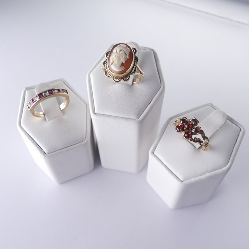 280 - A 9ct gold shell cameo Ring, Size O, together with a garnet cluster ring, Size P and a red and white... 