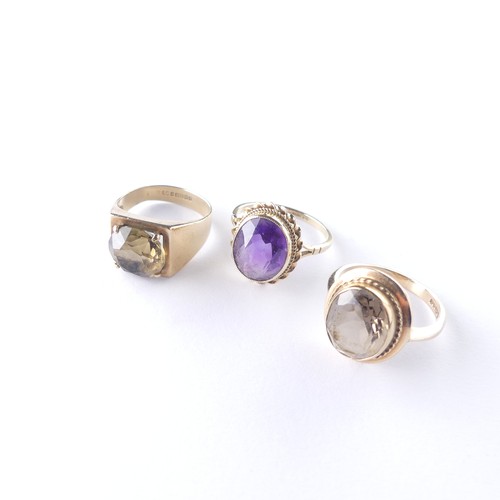 281 - A 9ct gold smoky quartz Ring, with ropetwist border, Size N, together with an amethyst ring, Size O ... 