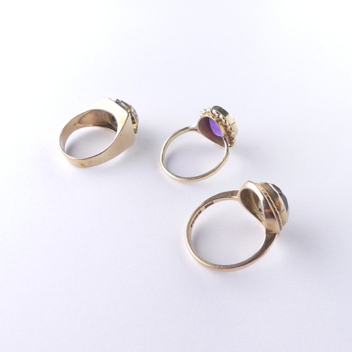 281 - A 9ct gold smoky quartz Ring, with ropetwist border, Size N, together with an amethyst ring, Size O ... 