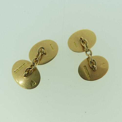 469 - A pair of 15ct gold oval Cufflinks, both sides with foliate engraved decoration, 9.5g.... 