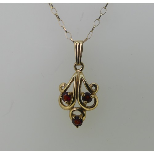 480 - A 9ct gold and garnet Pendant and Earring suite, the pendant 2.5cm long, approx total weight 4.2g.... 