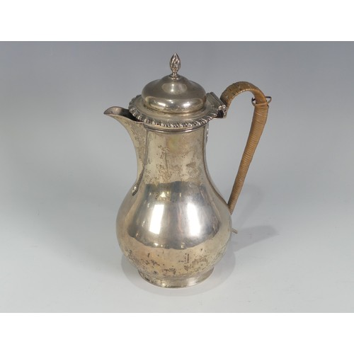 61 - A George V silver Hot Water Pot, by John Henry Rawlings, hallmarked London, 1912, of plain baluster ... 