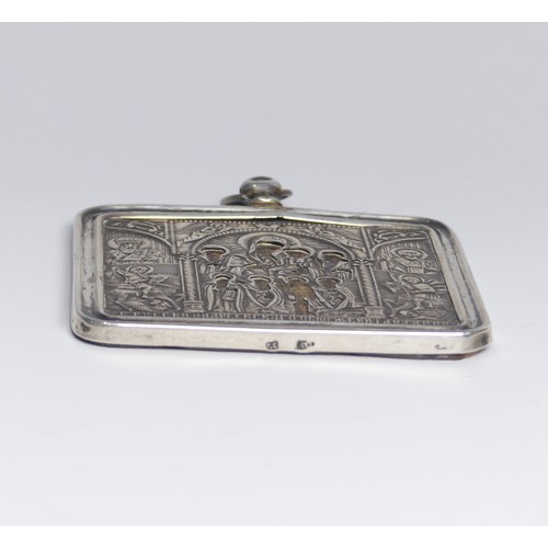 73 - A Russian silver mounted Icon, with velvet reverse, 6.5cm wide.