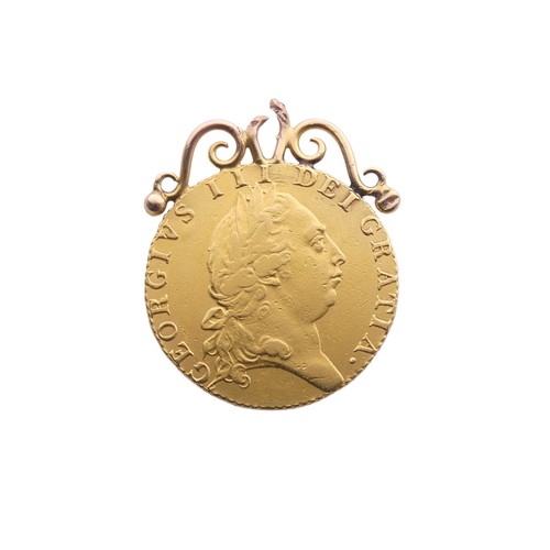 726 - A George III gold Guinea, dated 1792, with soldered mount, total weight 9.1g.