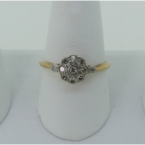 296 - A small diamond cluster Ring, all mounted in 18ct yellow gold and platinum, Size P, 2.3g.... 