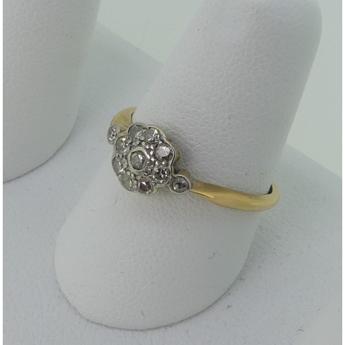 296 - A small diamond cluster Ring, all mounted in 18ct yellow gold and platinum, Size P, 2.3g.... 