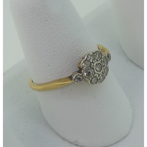 296 - A small diamond cluster Ring, all mounted in 18ct yellow gold and platinum, Size P, 2.3g.... 