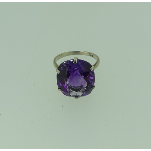 297 - An amethyst Dress Ring, the oval facetted stone 15.75x13.9mm, claw set in 9ct white gold, Size N, 4.... 