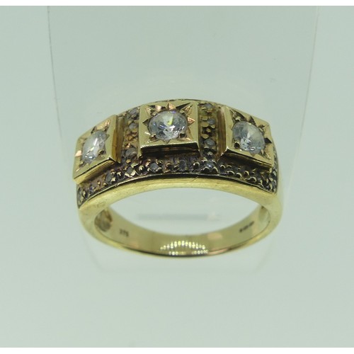 298 - A three stone white paste Ring, in squared 9ct gold mount, set small diamond points, Size N, 4.7g.... 