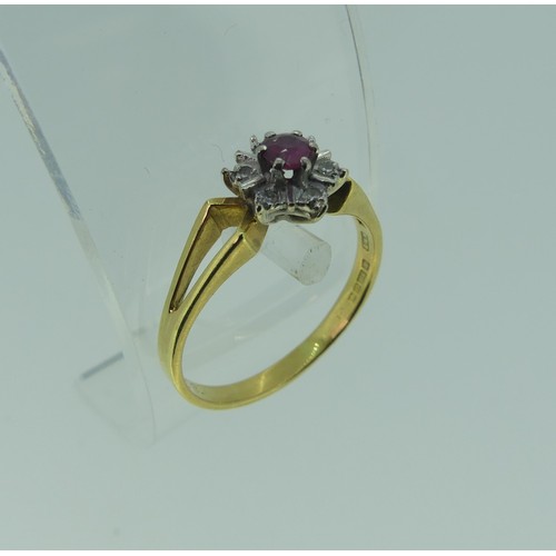 299 - A small ruby and diamond cluster Ring, mounted in 18ct yellow and white gold with split shoulders, S... 