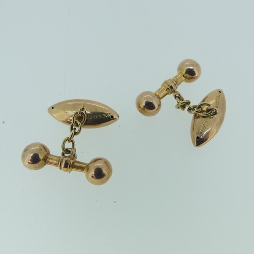 483 - A pair of 9ct rose gold hollow Cufflinks, the navette shaped fronts with foliate decoration, bar rev... 