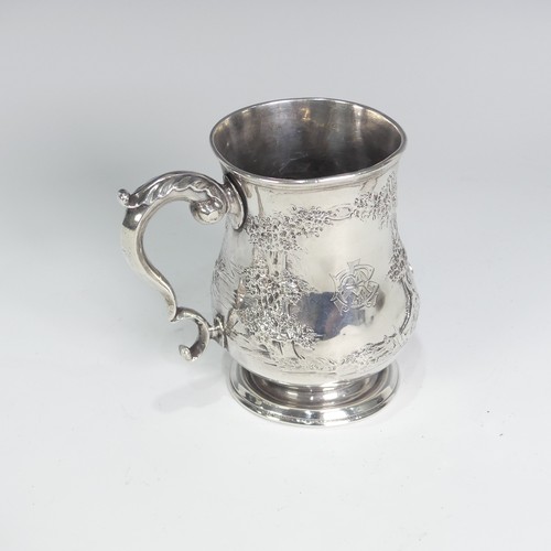 84 - A Victorian silver Half Pint Mug, hallmarked London, 1874, decorated in relief with agricultural she... 